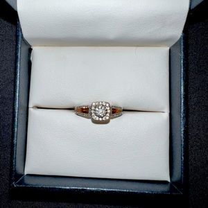 White and rose gold diamond engagement ring.